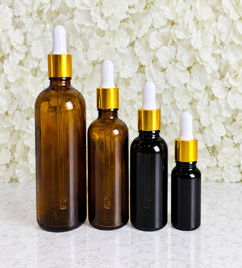amber bottles with golden dropper